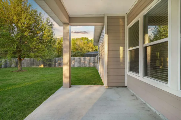 a view of a park with large trees