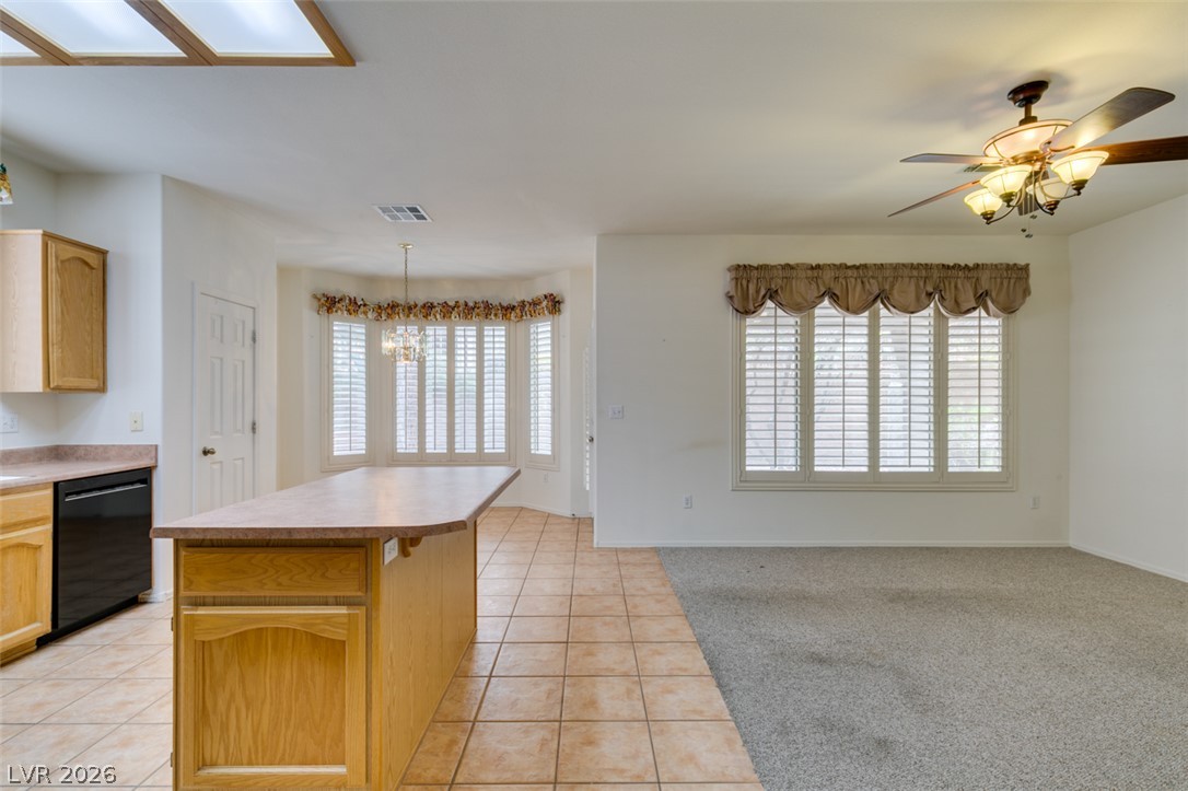 2189 Chapman Ranch Drive Henderson, NV 89012 - Photo 16 of 60 An open layout connects the kitchen, dining nook, and living space seamlessly.