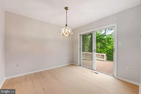a view of a chandelier in a room and a windows