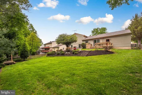 a front view of house with yard and outdoor seating