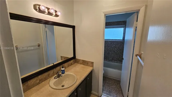 a bathroom with a bathtub and toilet