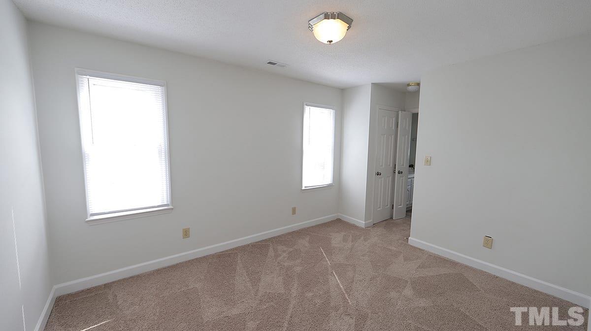 3712 East Jameson Road Raleigh, NC 27604 - Photo 12 of 20 an empty room with windows