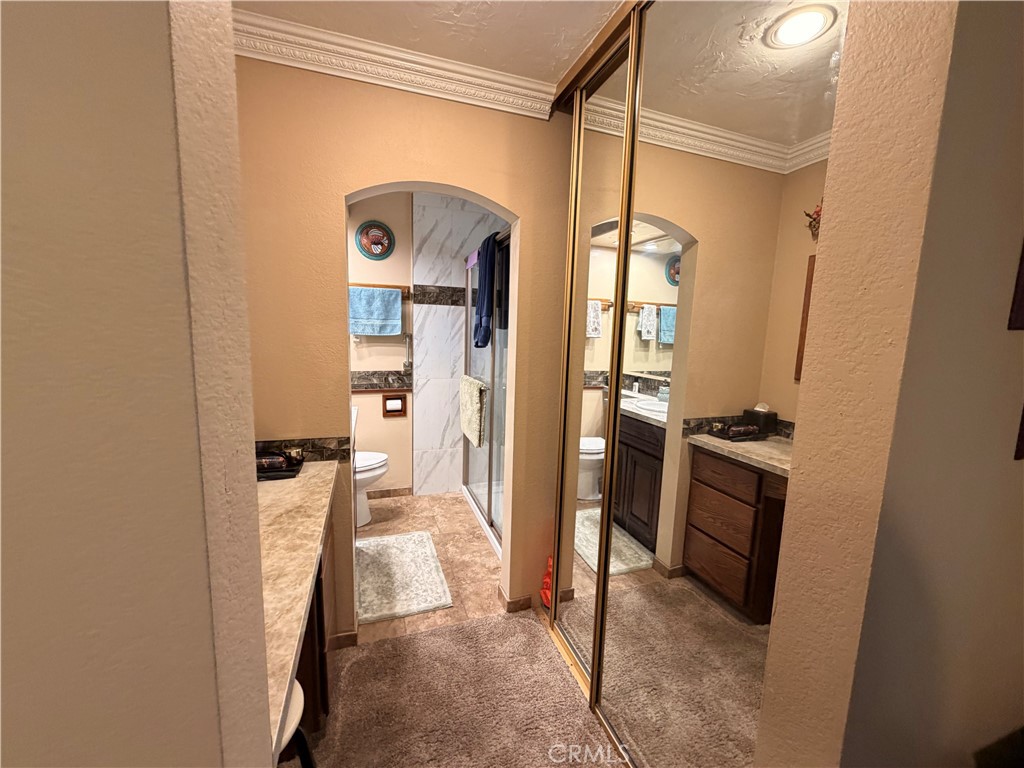 32360 Navajo Road Wildomar, CA 92595 - Photo 12 of 58 a view of a bathroom from a hallway