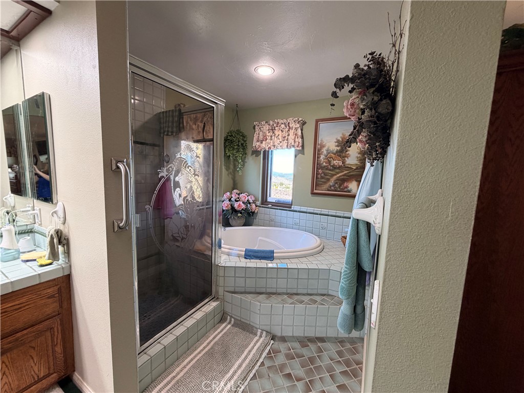 32360 Navajo Road Wildomar, CA 92595 - Photo 26 of 58 a bathroom with a sink and a mirror