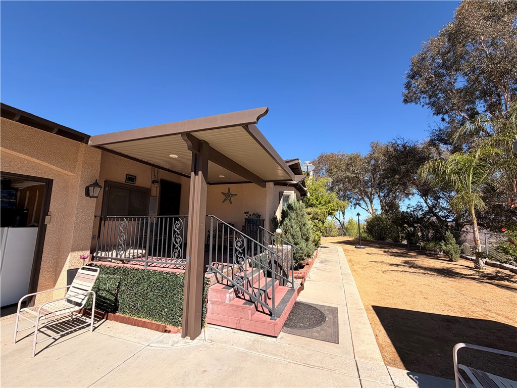 32360 Navajo Road Wildomar, CA 92595 - Photo 28 of 58 a view of a house with a patio