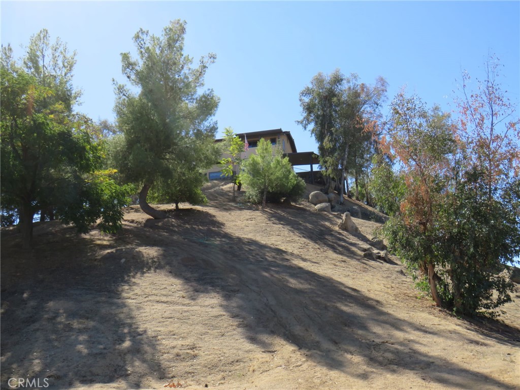 32360 Navajo Road Wildomar, CA 92595 - Photo 3 of 58 a view of a street with trees on both side of it