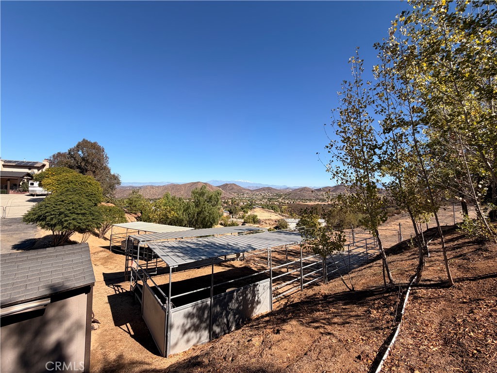 32360 Navajo Road Wildomar, CA 92595 - Photo 41 of 58 a view of a terrace with a bench