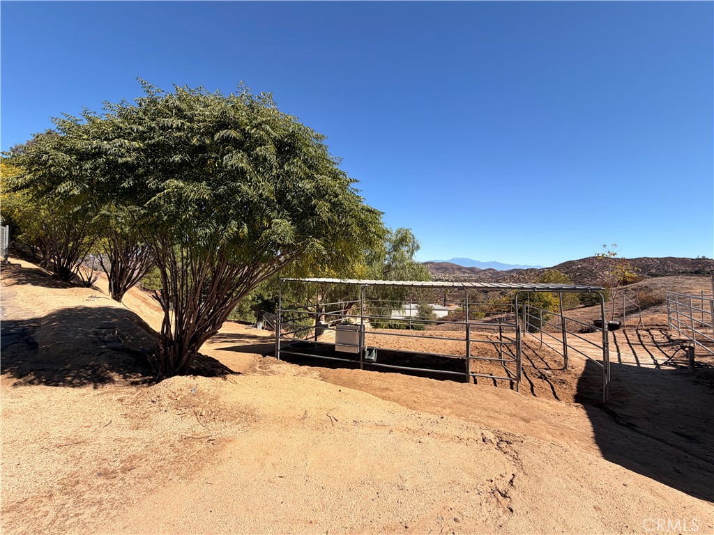 32360 Navajo Road Wildomar, CA 92595 - Photo 44 of 58 a view of a roof deck with a house in the background