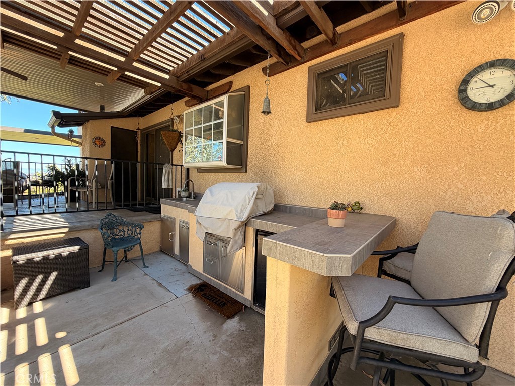 32360 Navajo Road Wildomar, CA 92595 - Photo 45 of 58 a view of a room with furniture and a kitchen