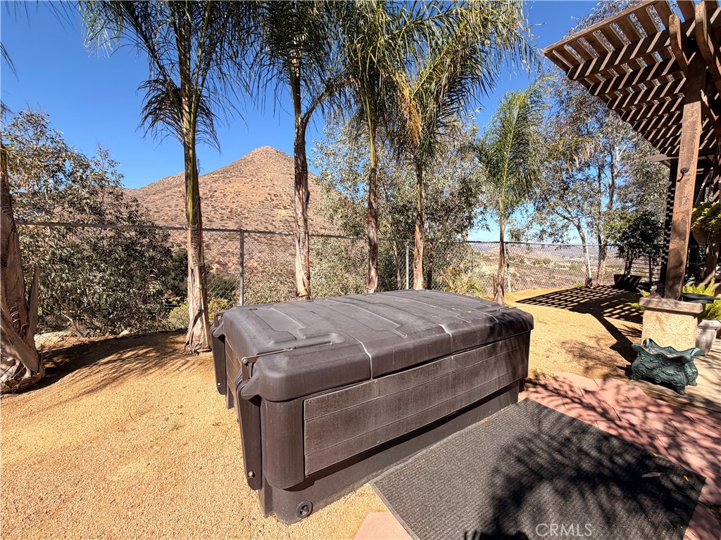 32360 Navajo Road Wildomar, CA 92595 - Photo 46 of 58 a view of a backyard with wooden fence