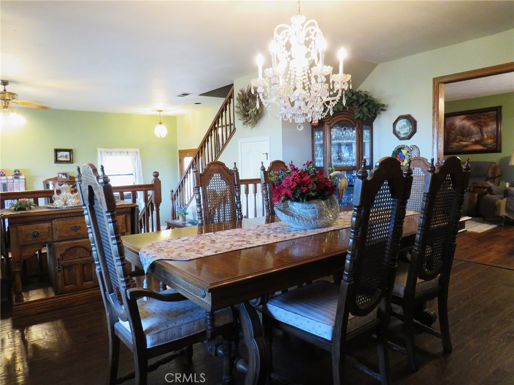 32360 Navajo Road Wildomar, CA 92595 - Photo 7 of 58 a view of a dining room with furniture and chandelier