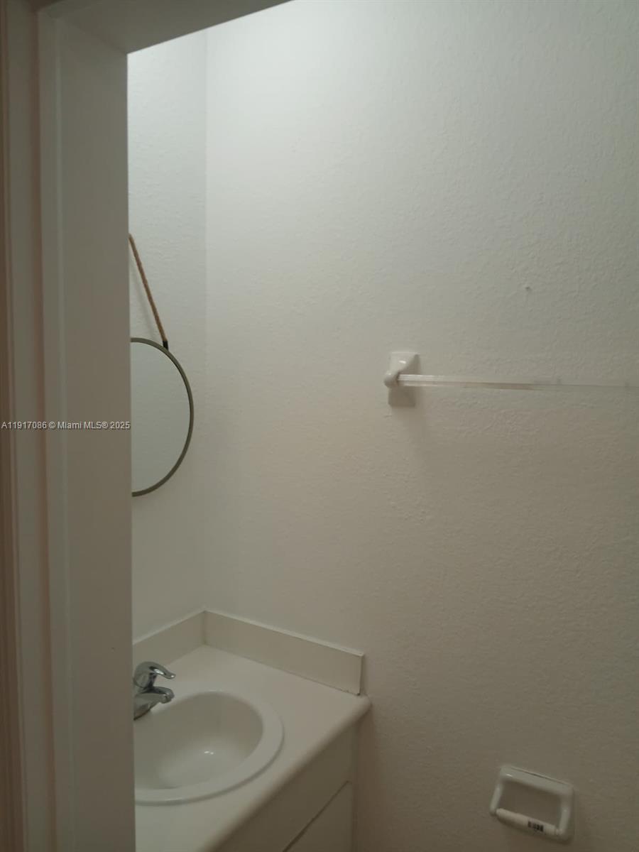 24386 Southwest 109th Court, Unit / Homestead, FL 33032 - Photo 17 of 33 a bathroom with a sink and toilet