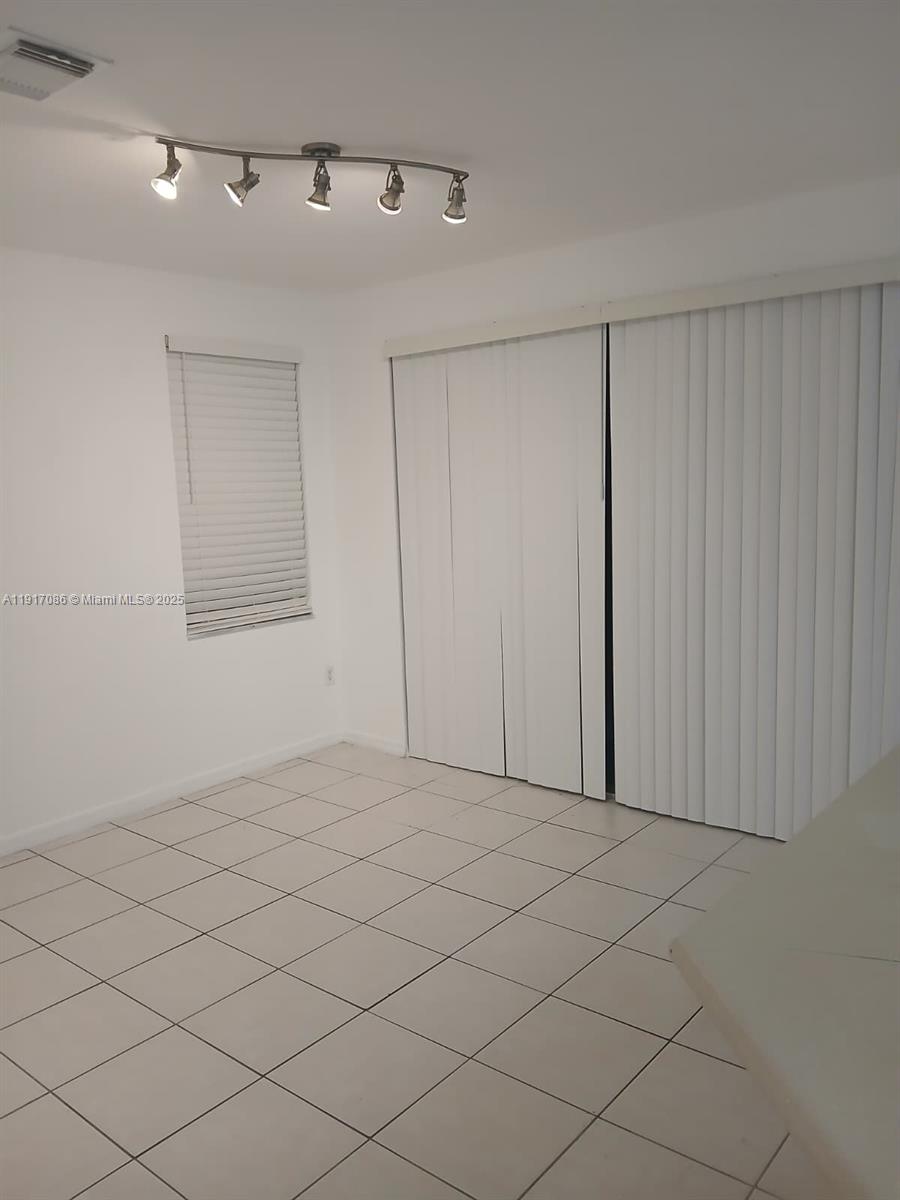 24386 Southwest 109th Court, Unit / Homestead, FL 33032 - Photo 18 of 33 a view of an empty room