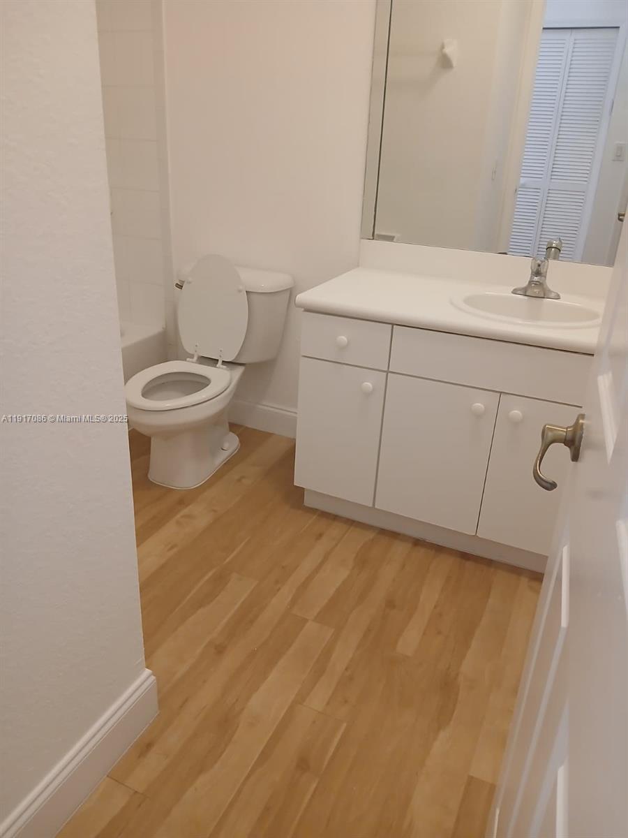 24386 Southwest 109th Court, Unit / Homestead, FL 33032 - Photo 26 of 33 a bathroom with a sink and a toilet