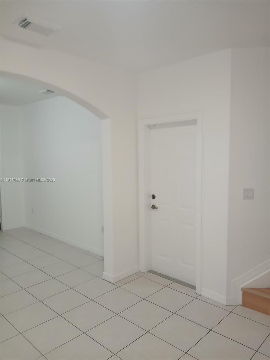 24386 Southwest 109th Court, Unit / Homestead, FL 33032 - Photo 27 of 33 a view of an empty room