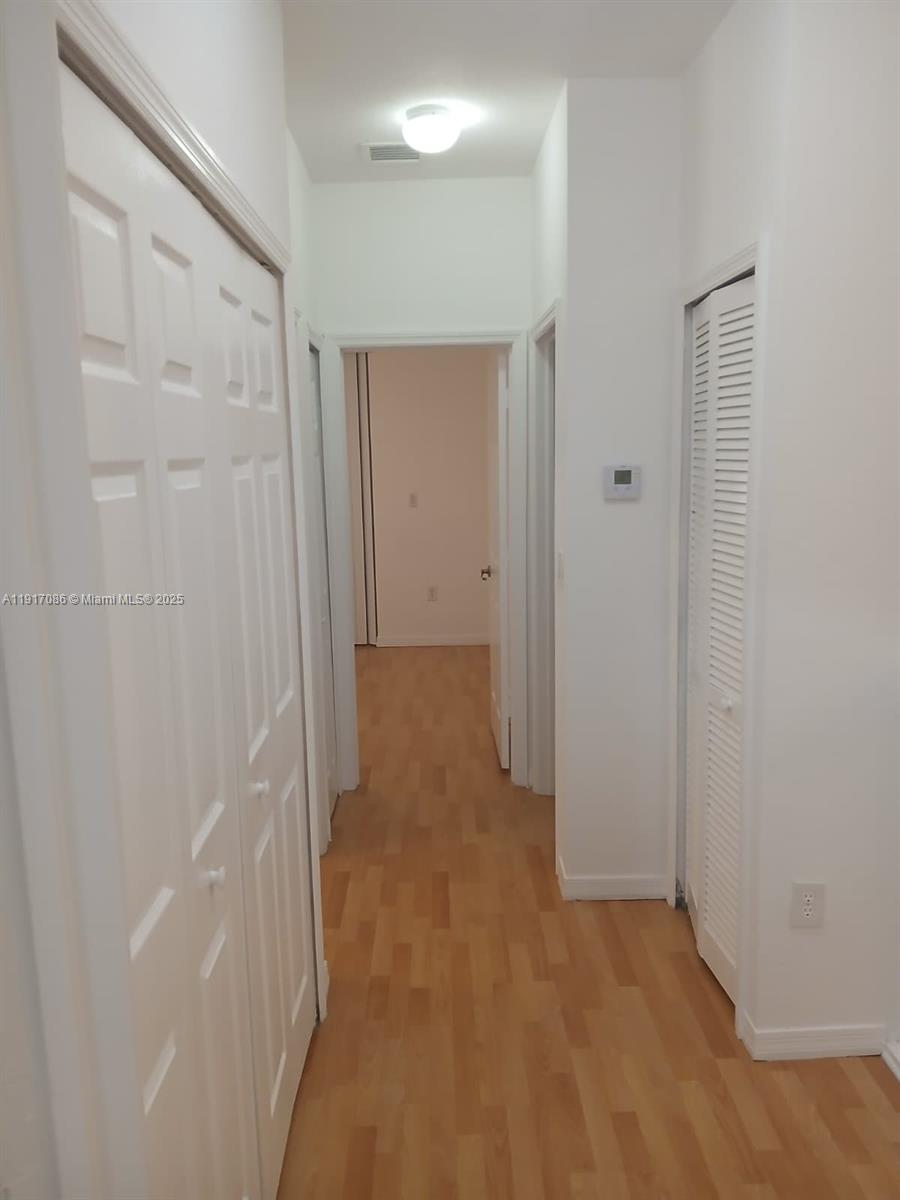 24386 Southwest 109th Court, Unit / Homestead, FL 33032 - Photo 31 of 33 a view of a hallway