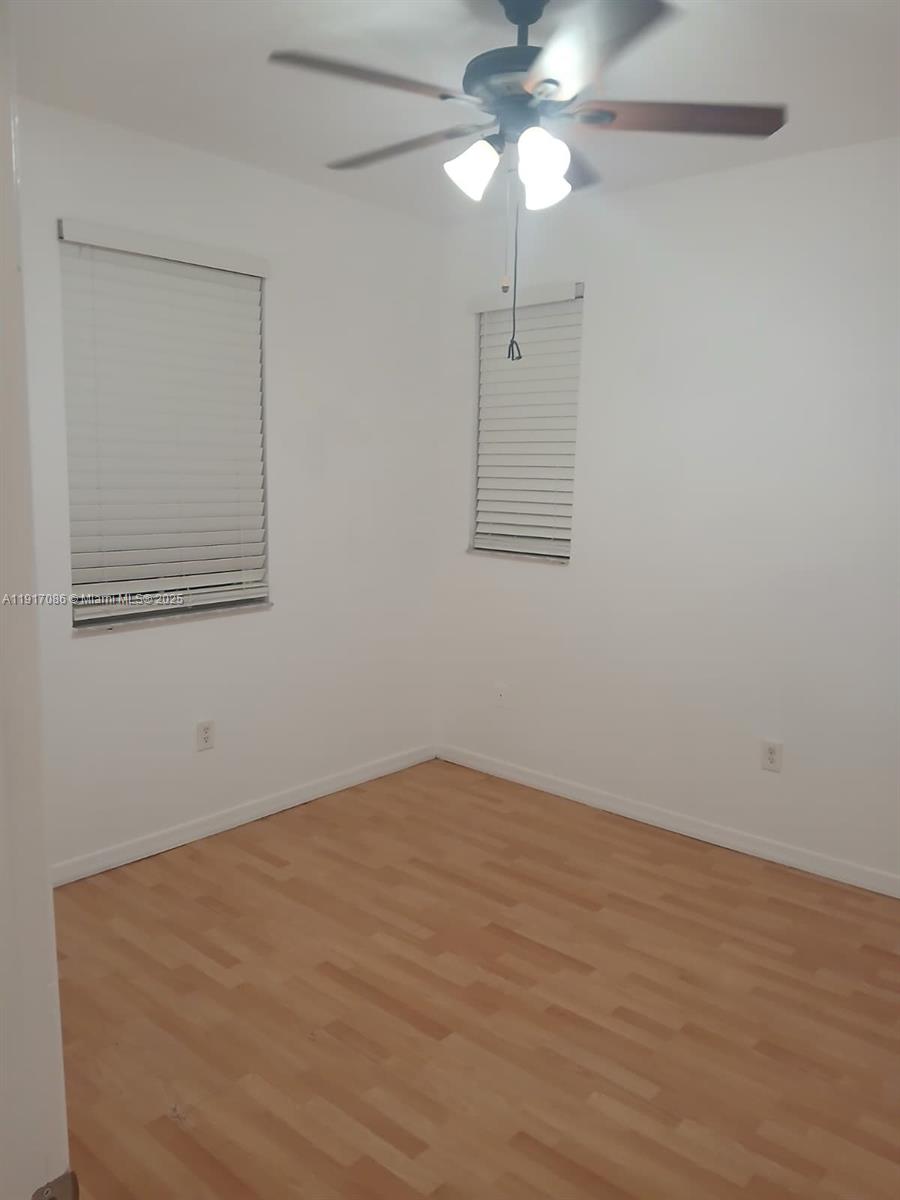 24386 Southwest 109th Court, Unit / Homestead, FL 33032 - Photo 5 of 33 a view of an empty room with a fan