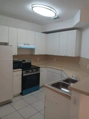 a bathroom with a toilet sink and a mirror