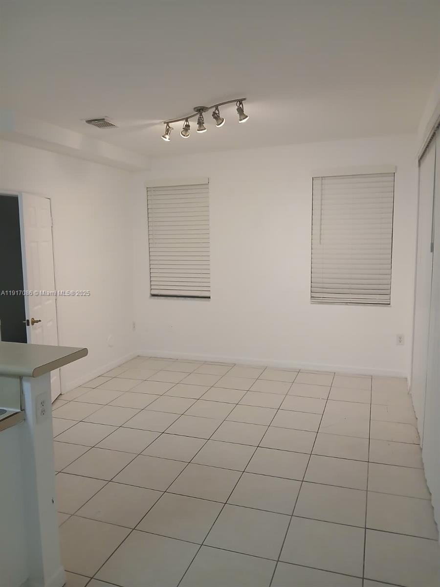 24386 Southwest 109th Court, Unit / Homestead, FL 33032 - Photo 10 of 33 a view of an empty room