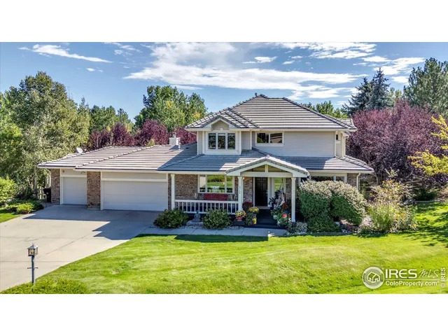 a view of a big house with a big yard