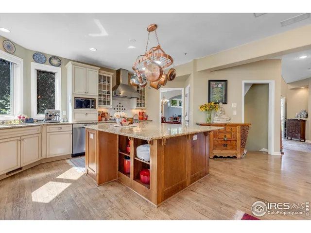 a kitchen with stainless steel appliances granite countertop a stove and a sink