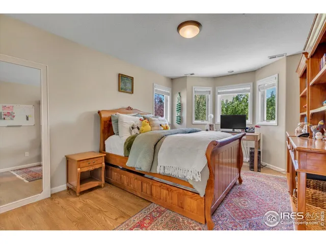 a bedroom with furniture and a window