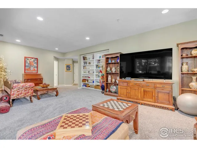 a bedroom with a bed a table and chair