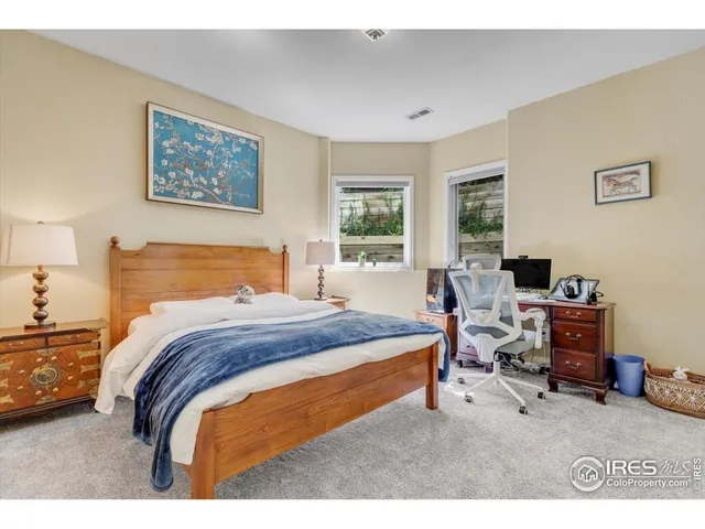 a living room with a bed and a table