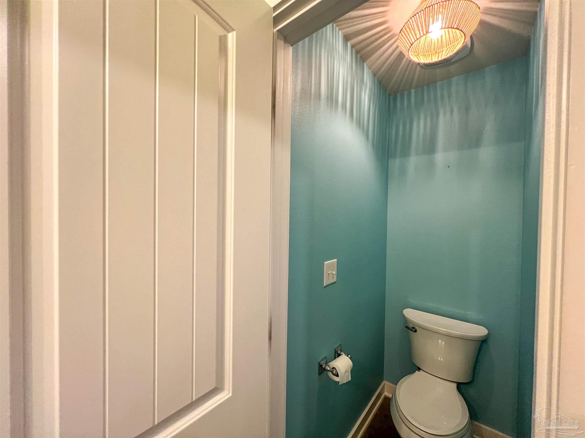 4906 Landmark Lane Pace, FL 32571 - Photo 18 of 34 a bathroom with a toilet and a sink