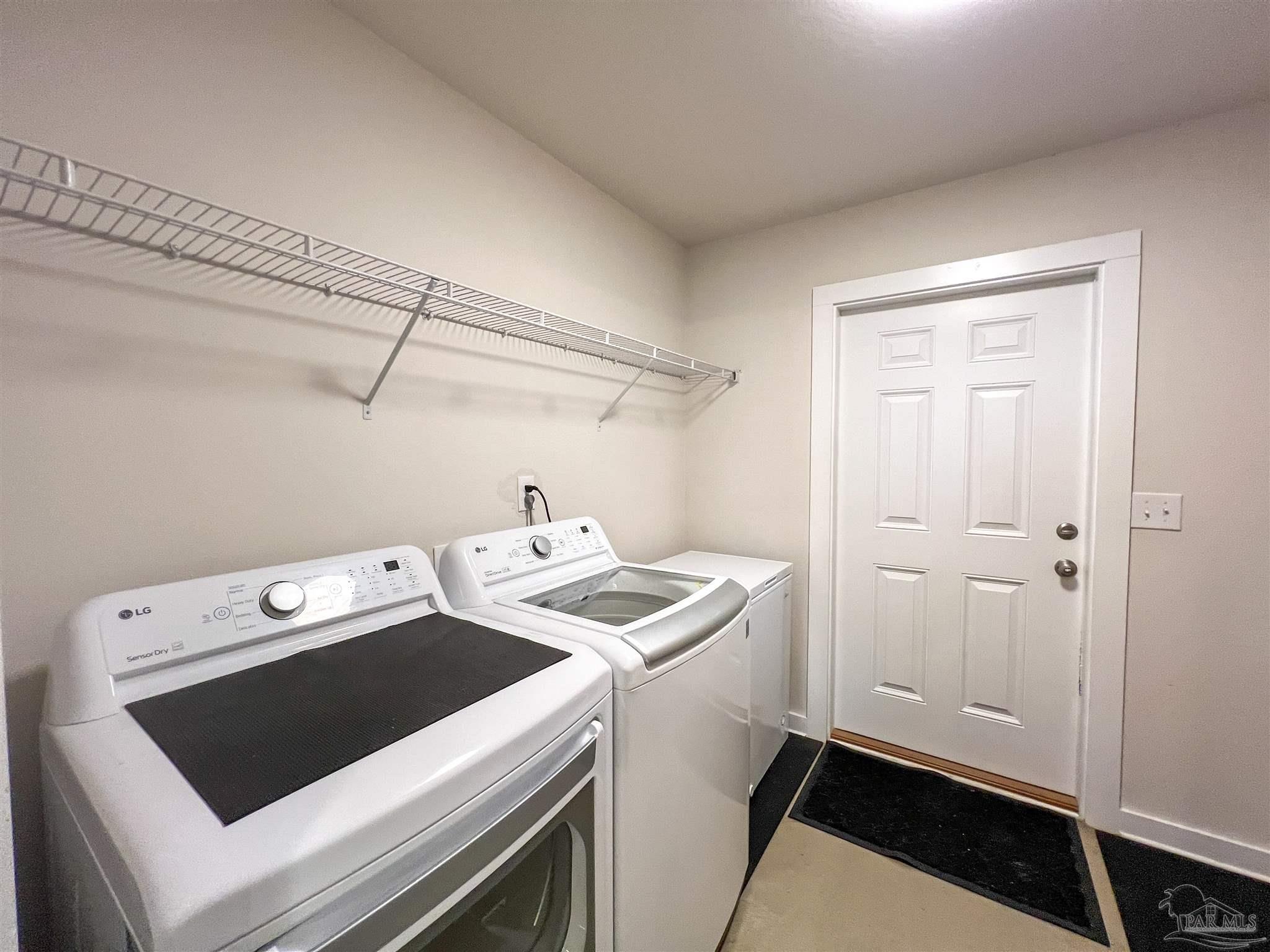 4906 Landmark Lane Pace, FL 32571 - Photo 25 of 34 a utility room with dryer and washer