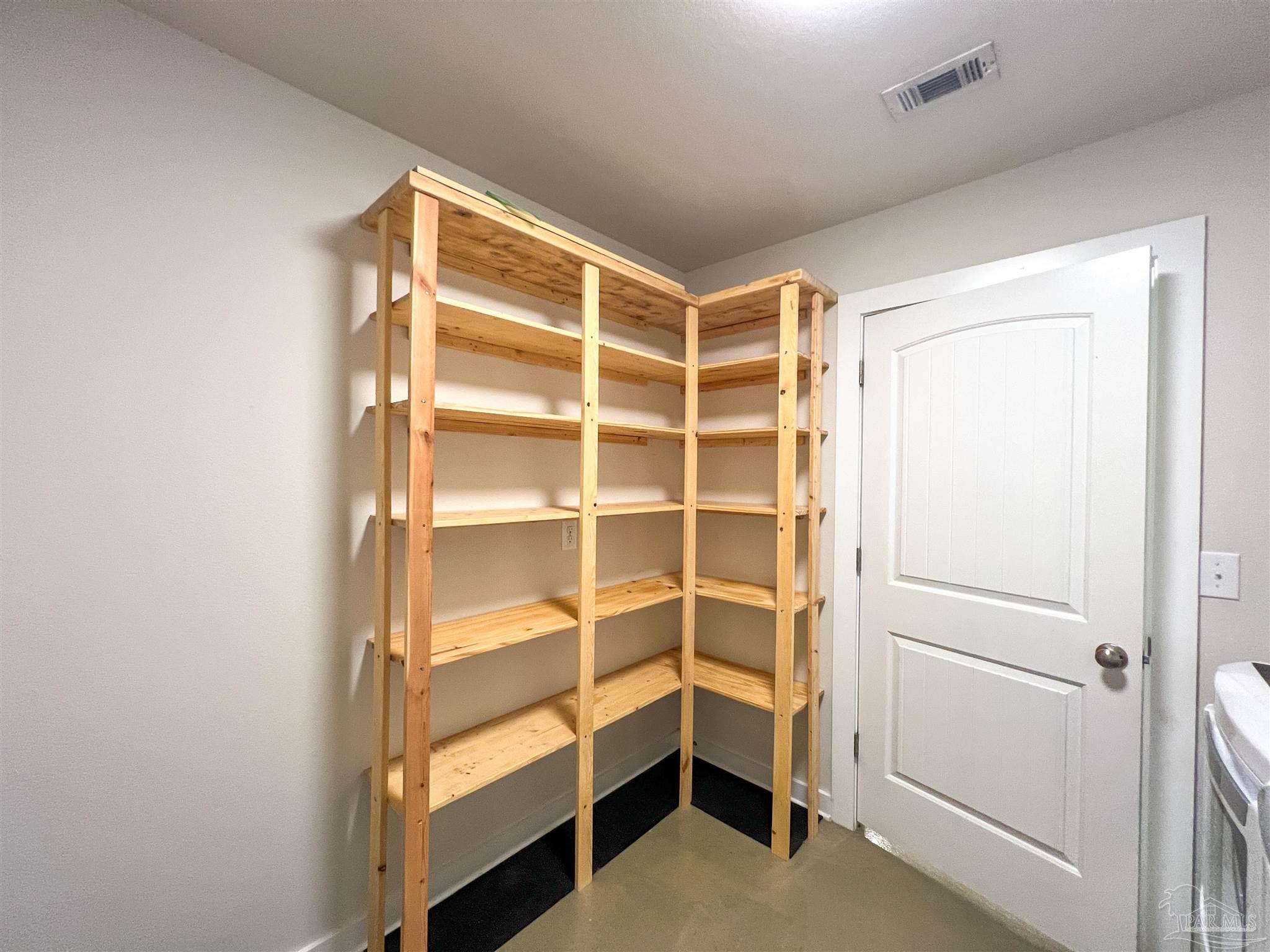 4906 Landmark Lane Pace, FL 32571 - Photo 26 of 34 a view of an empty walk in closet