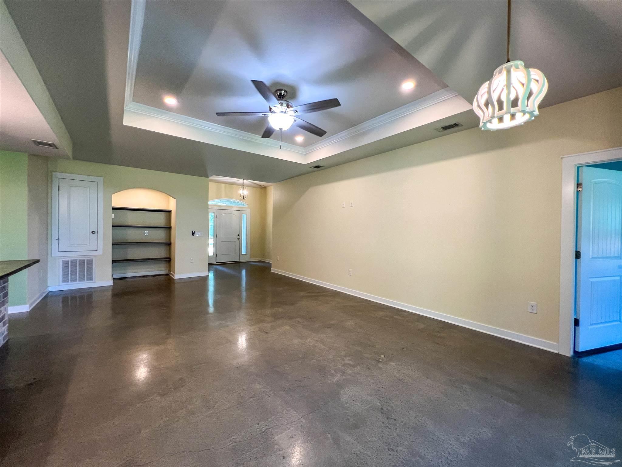 4906 Landmark Lane Pace, FL 32571 - Photo 8 of 34 a view of a livingroom with a kitchen