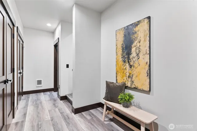 a view of workspace with furniture and wooden floor