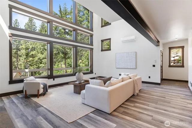 a living room with furniture and windows