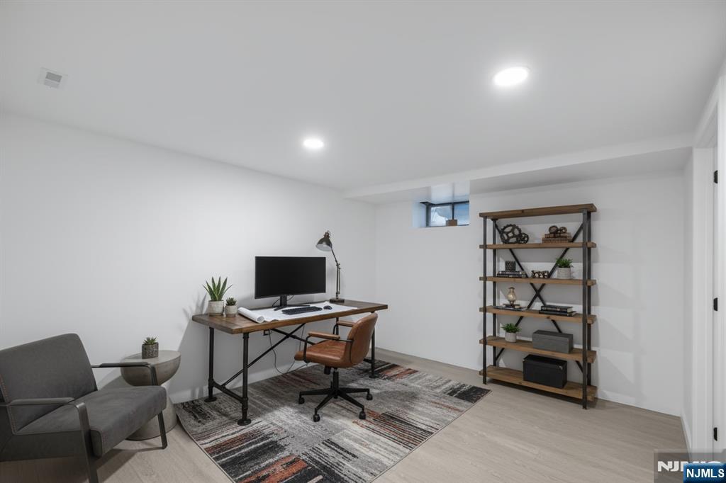 11 Adams Street Clifton, NJ 07011 - Photo 18 of 24 a view of a workspace with furniture and a window