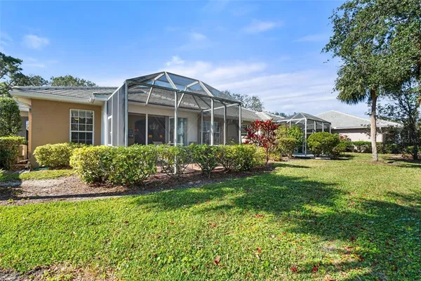 an aerial view of a house with a yard and garden