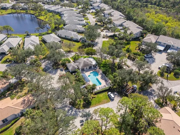 an aerial view of residential houses with outdoor space
