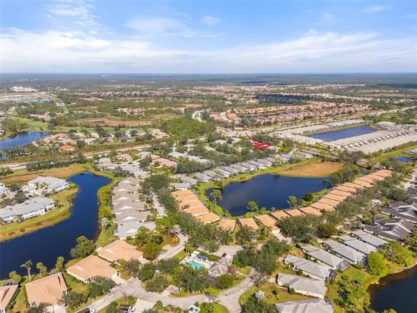 an aerial view of residential houses with outdoor space