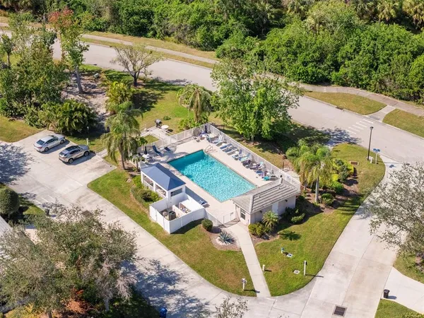 an aerial view of residential houses with outdoor space