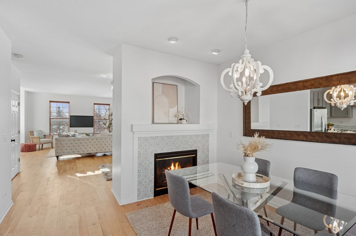 152 Jackson Street Gilberts, IL 60136 - Photo 11 of 32 a living room with furniture a chandelier and a fireplace