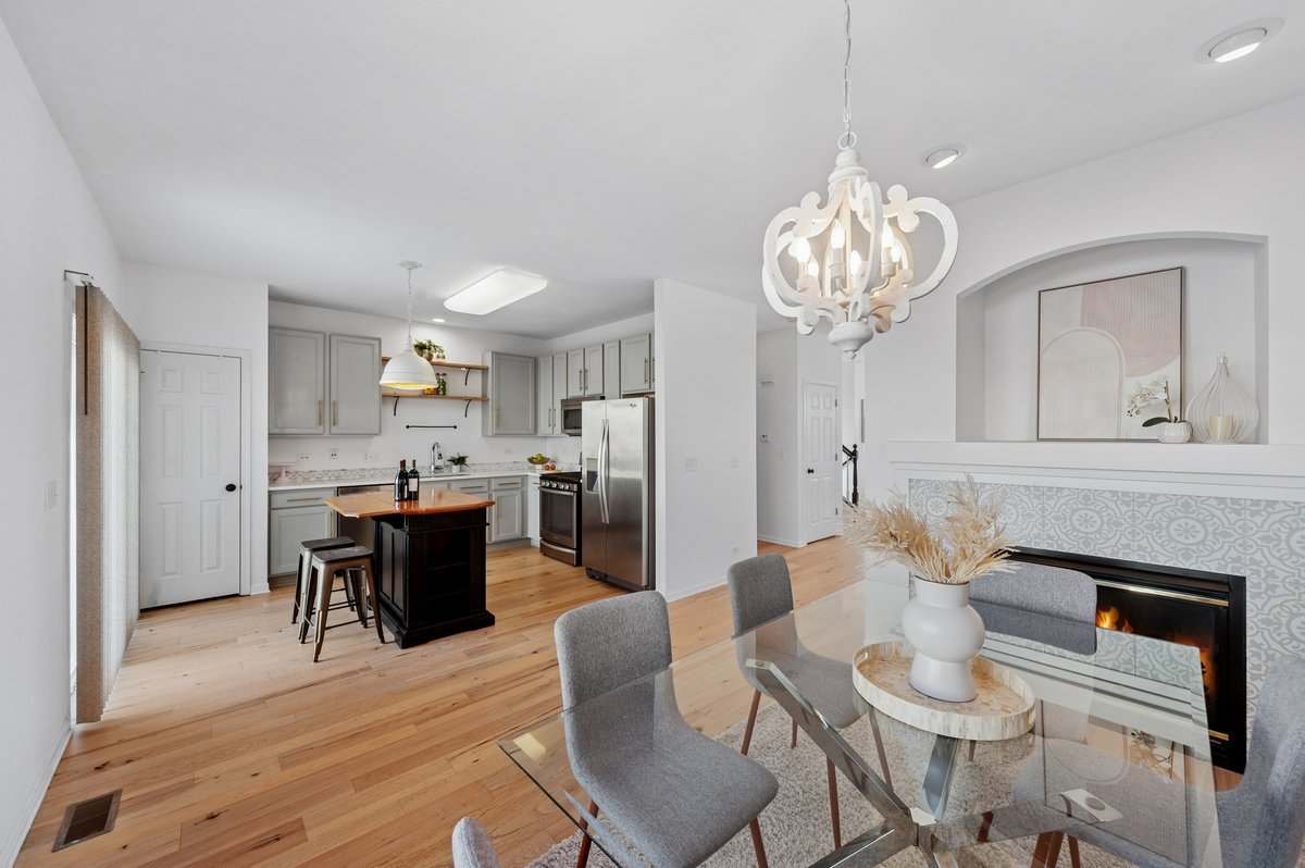 152 Jackson Street Gilberts, IL 60136 - Photo 15 of 32 a view of a dining room with furniture and wooden floor