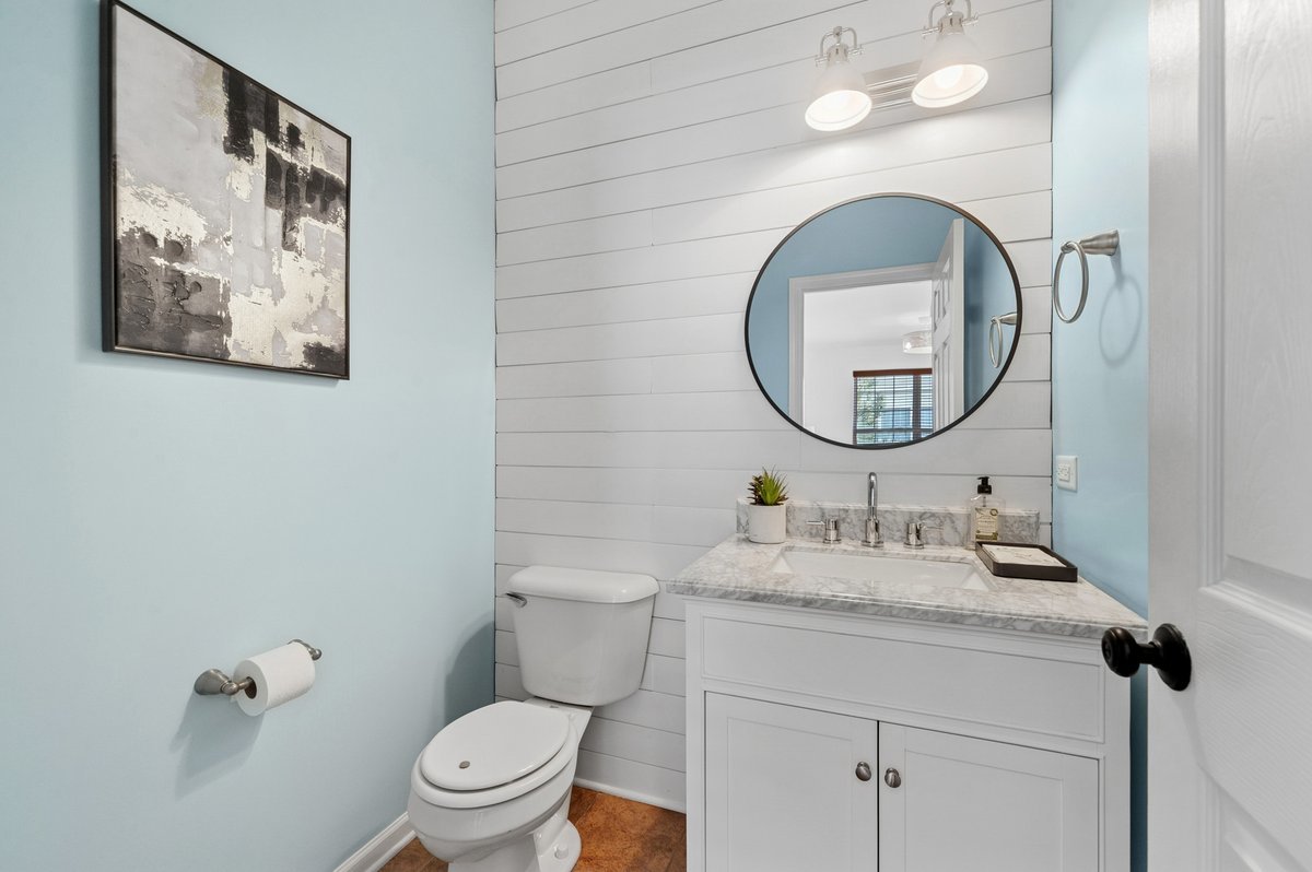 152 Jackson Street Gilberts, IL 60136 - Photo 16 of 32 a bathroom with a toilet a sink and mirror