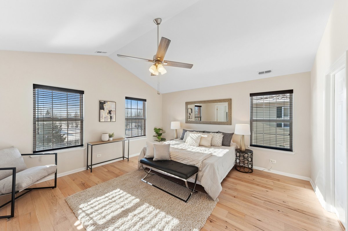 152 Jackson Street Gilberts, IL 60136 - Photo 20 of 32 a bedroom with a bed wooden floor and window