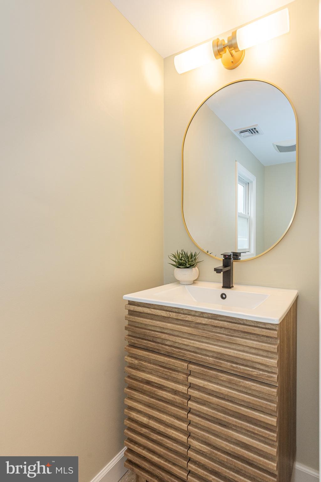 229 South Main Street Pennington, NJ 08534 - Photo 11 of 36 a bathroom with a sink and a mirror