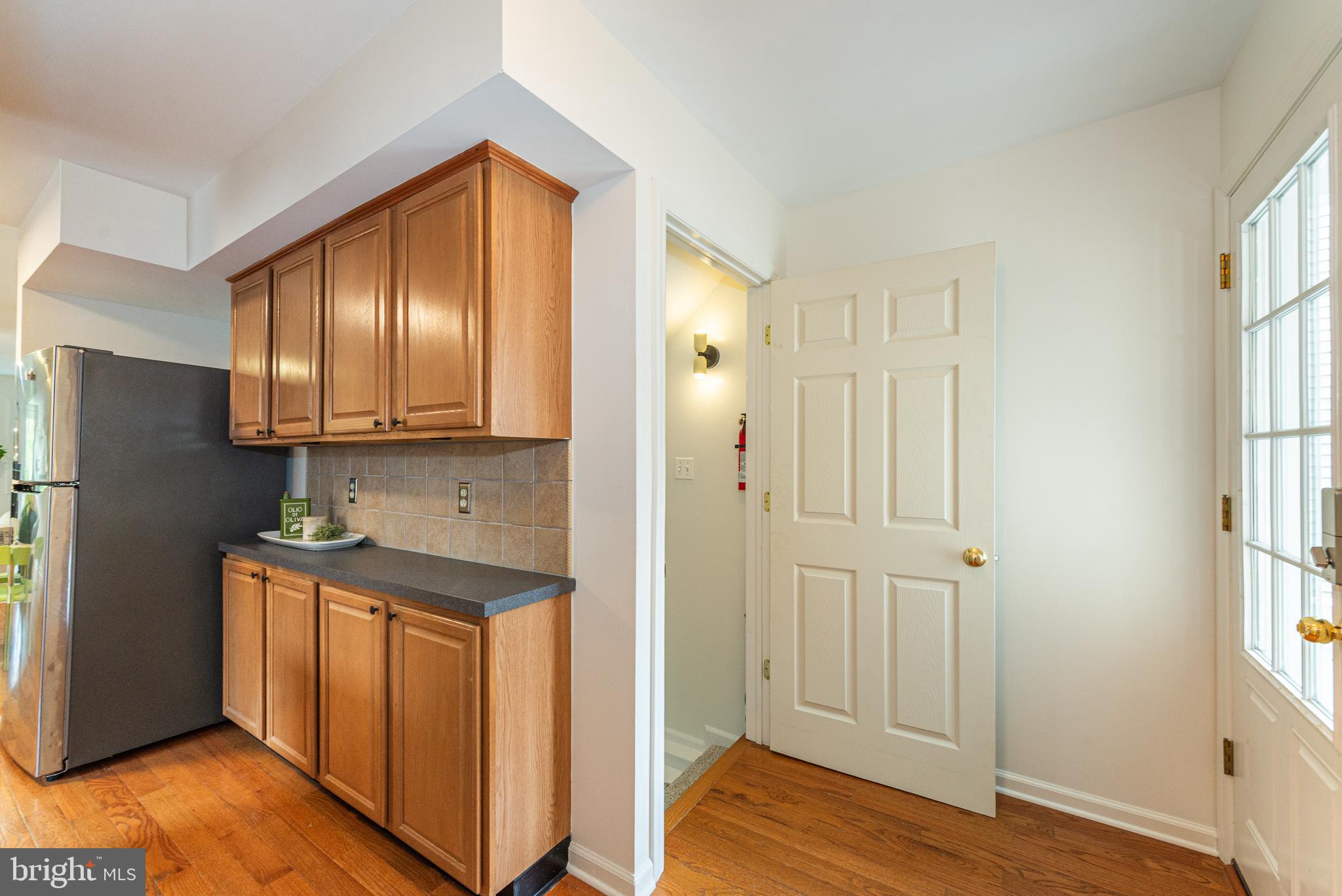 229 South Main Street Pennington, NJ 08534 - Photo 12 of 36 a view of a kitchen with wooden floor and electronic appliances