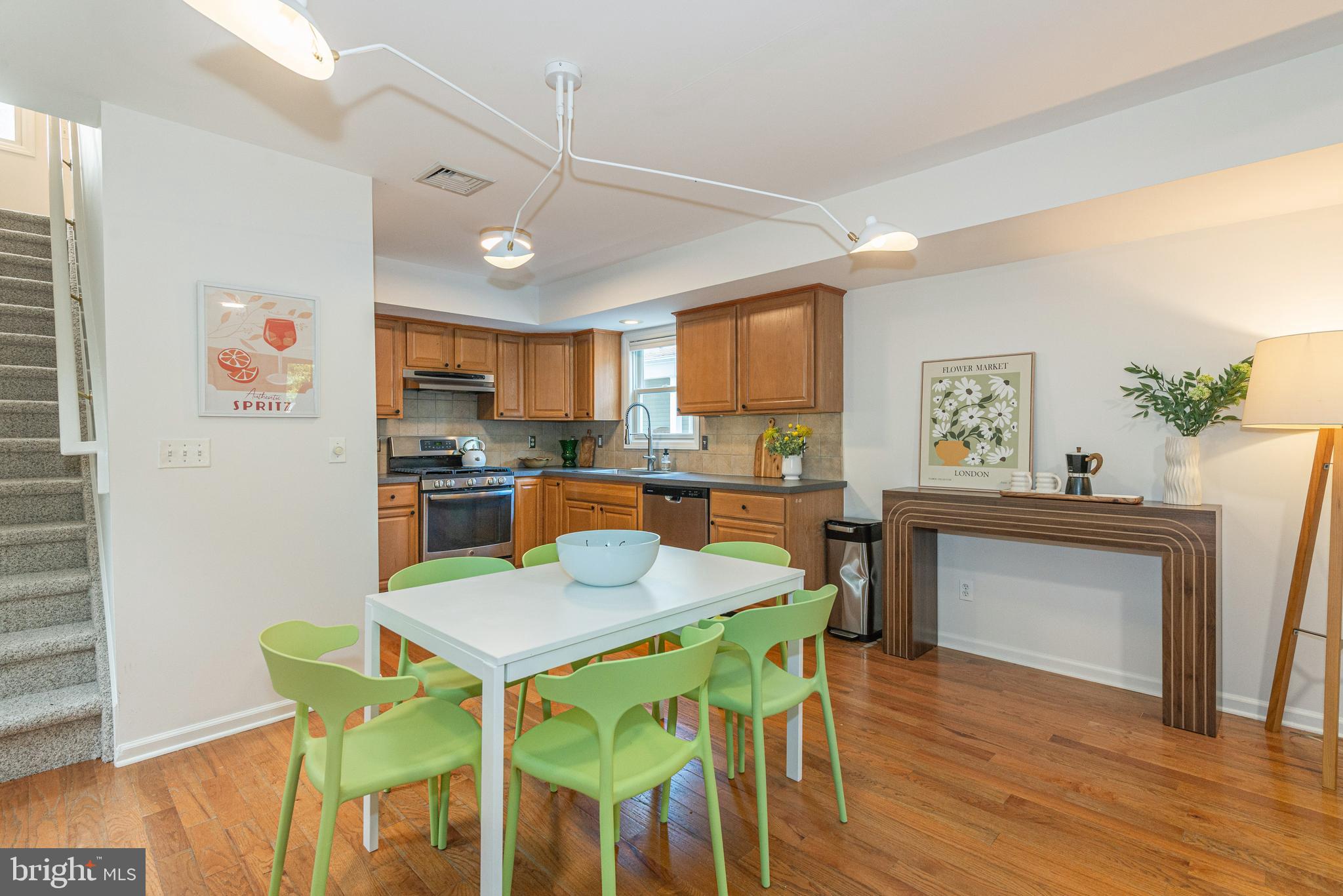 229 South Main Street Pennington, NJ 08534 - Photo 15 of 36 a kitchen with a dining table chairs and refrigerator