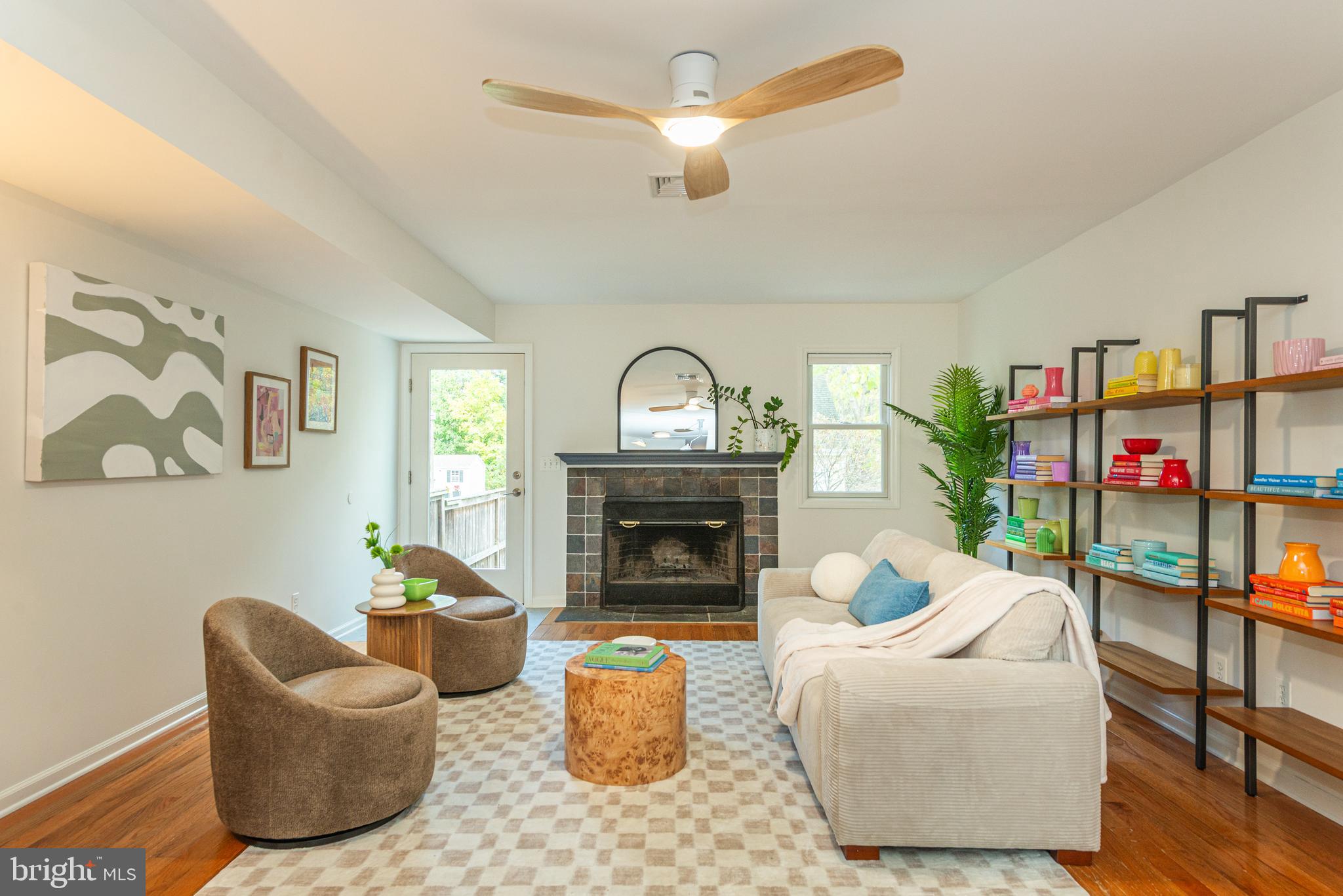 229 South Main Street Pennington, NJ 08534 - Photo 18 of 36 a living room with furniture a fireplace and a ceiling fan