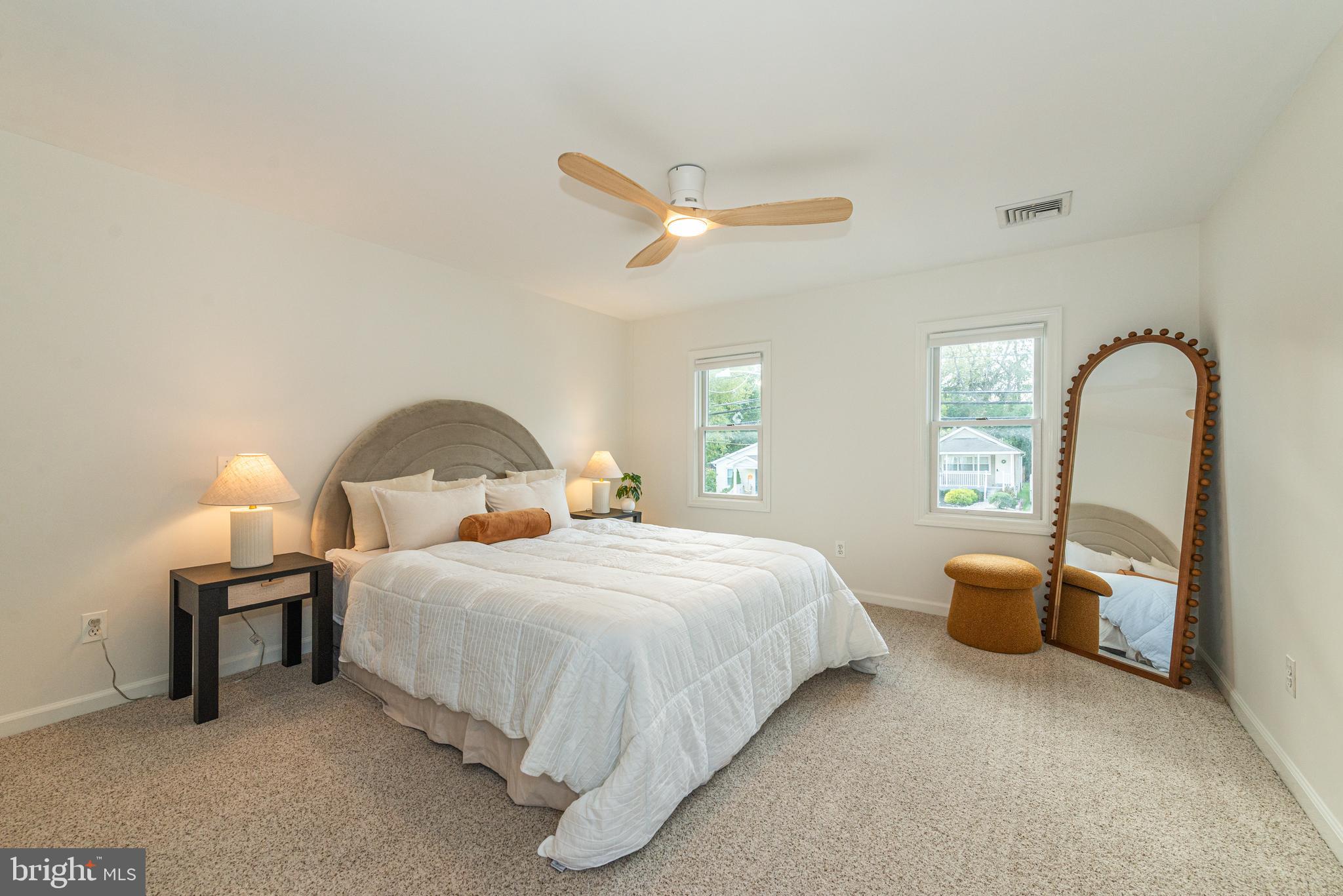 229 South Main Street Pennington, NJ 08534 - Photo 19 of 36 a bedroom with a bed wooden floor and window