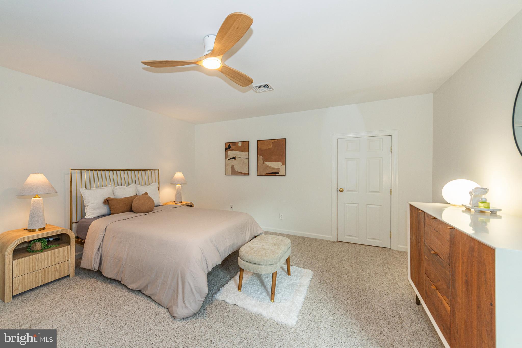 229 South Main Street Pennington, NJ 08534 - Photo 28 of 36 a bedroom with a bed and a chandelier