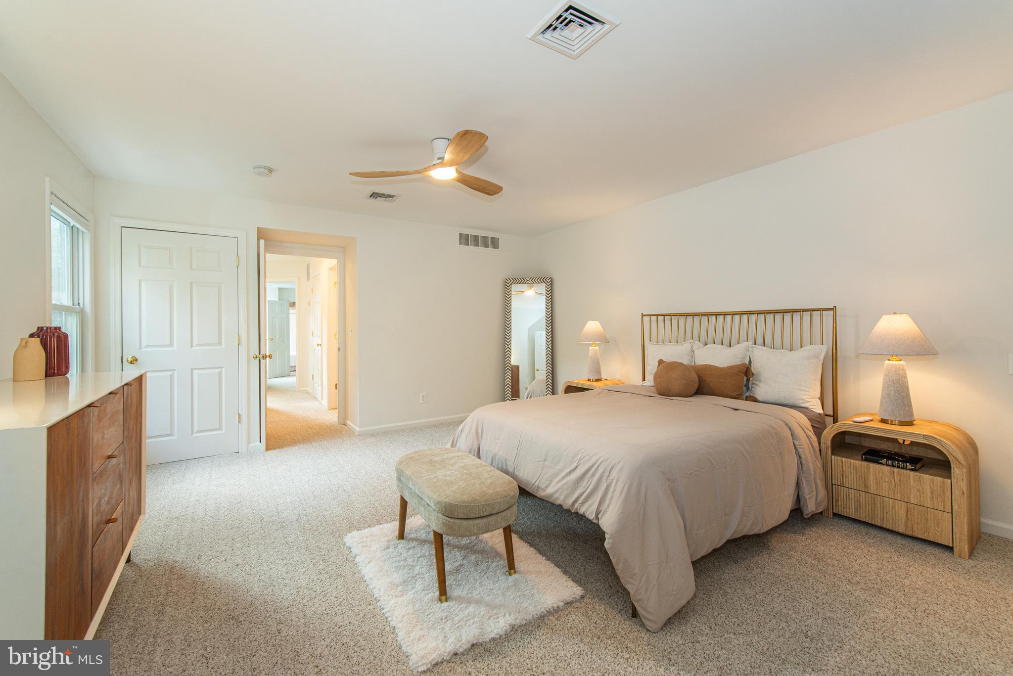 229 South Main Street Pennington, NJ 08534 - Photo 29 of 36 a bedroom with bed and a chandelier